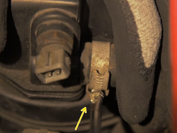 
Loosen the air connector hose clamp at the rear of the air box with a flat screwdriver
