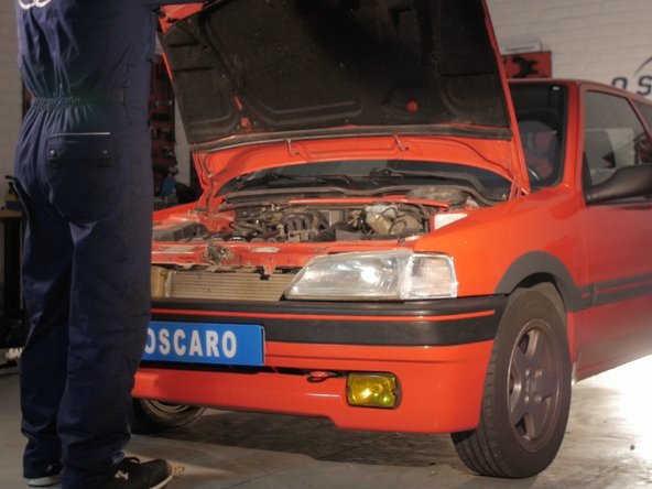 
Place your car on relatively flat ground and open the hood.
