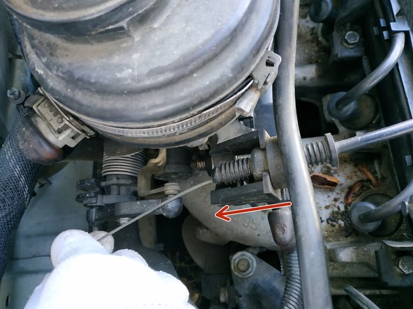 
Pass the throttle cable through the cable grommet
