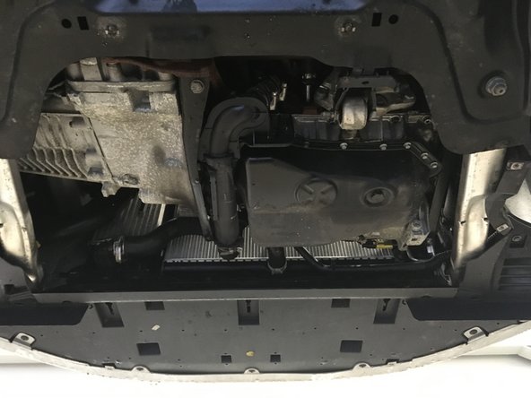 
Reassemble the plate under the engine
