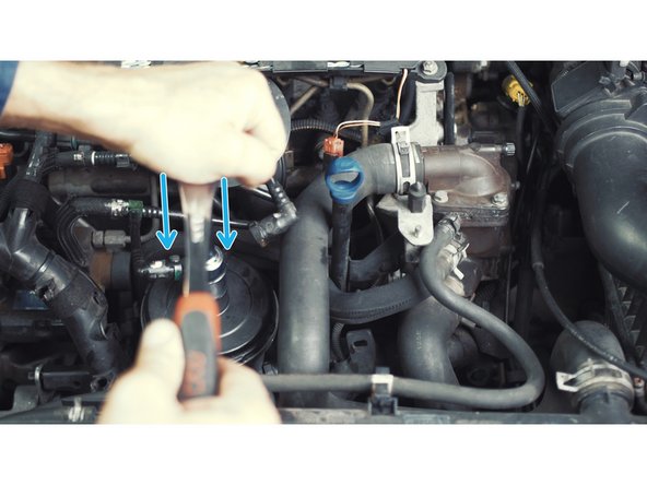 
Keep the cover pressed on the spring then turn about 1/4 turn until it stops.
