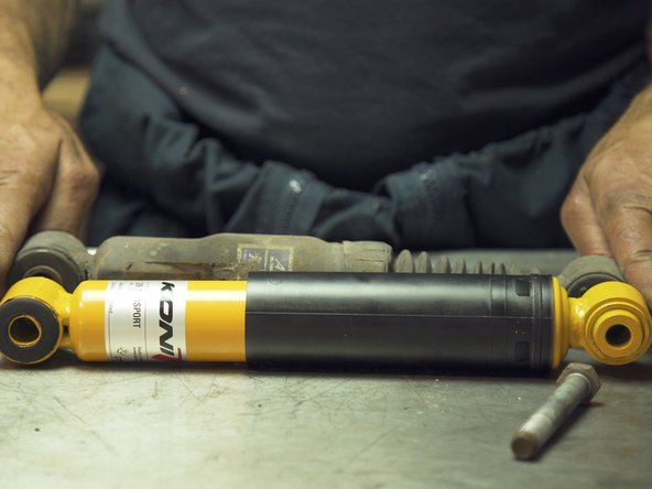 
Clean and then apply grease to the shock absorber retaining screws to facilitate reassembly and subsequent removal.
