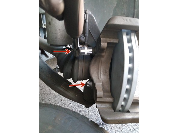 Replacer le support d'étrier et le fixer avec ses deux écrous