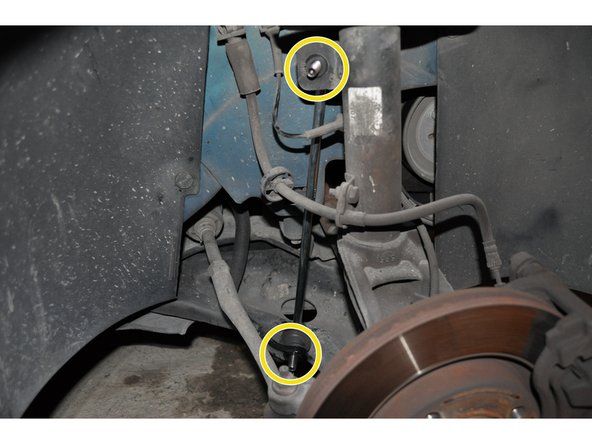 Placer les deux axes de la biellette sur les supports