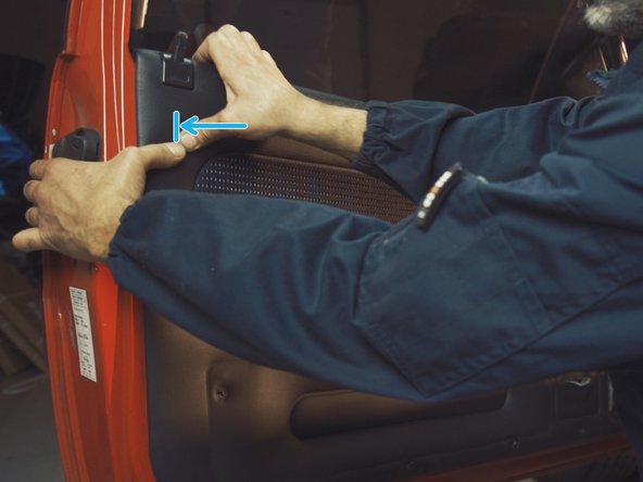 
Press the different parts of the door panel to engage the clips

