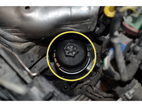 Serrer le filtre jusqu'au contact avec la main.