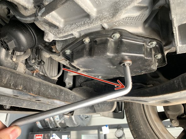 Mettre un bac sous le véhicule