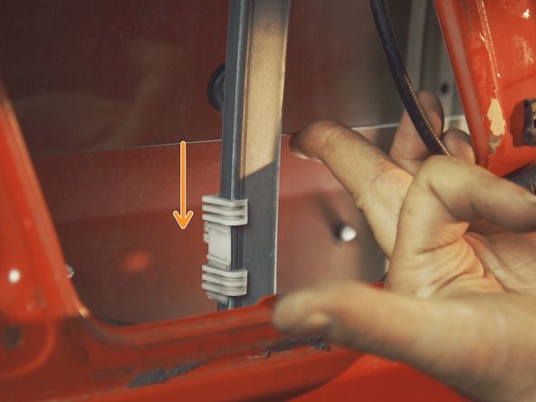 
Using the window lifter control, raise the window support up to the hole in the window
