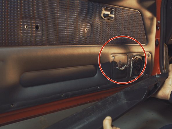 
Be careful to pass the window lifter control connectors through the holes in the storage compartment before removing
