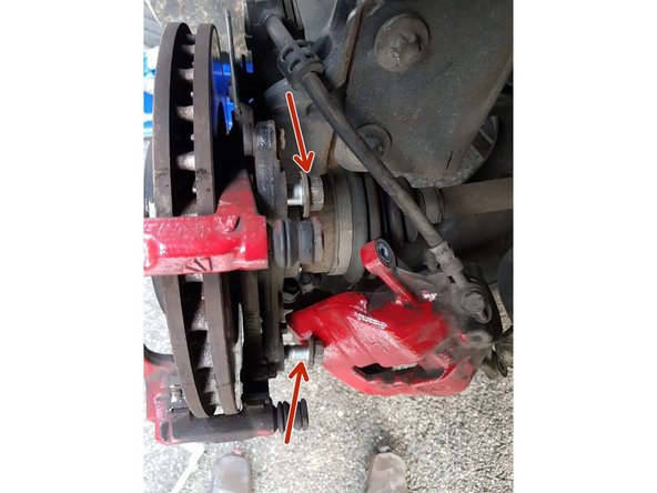 
Completely unscrew the 2 screws that hold the brake caliper part using a ratchet and an 18 socket, once the 2 screws are removed you can simply remove the caliper by pulling on it.
