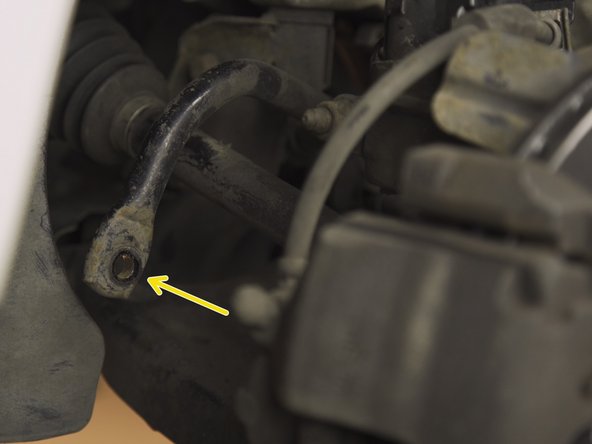 Insérer la tige filetée de la nouvelle biellette dans la barre antidevers