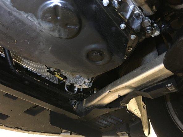 
Place a tray under the vehicle
