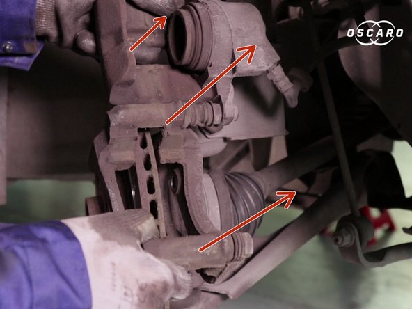 
Remove the caliper and attach it to the spring using a cable or wire
