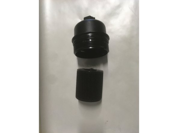 Retirer l'ancien filtre de la cloche en le tirant vers le bas