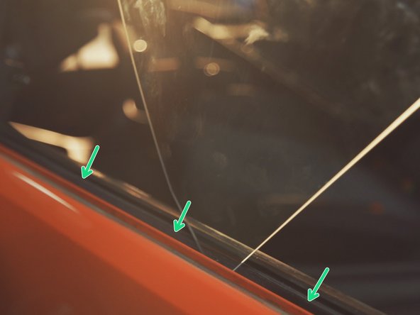 
Slide the glass between the door and the interior seal
