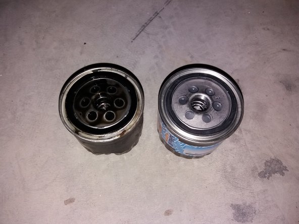 
Before screwing the new filter back on, you can put a drizzle of oil on the seal to make tightening easier.
