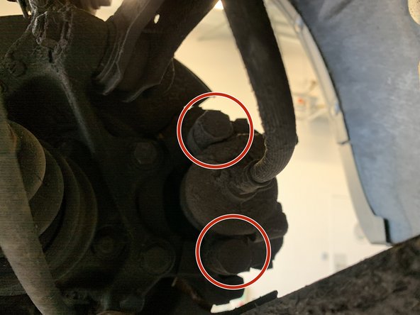 Retirer les deux caches de l'étrier