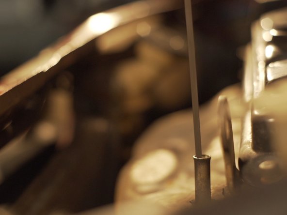 
Pull out the oil level dipstick and wipe off the old level
