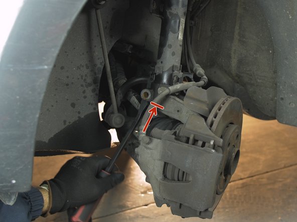 Placer un levier de force dans le porte moyeu, à l'emplacement de la précédente vis