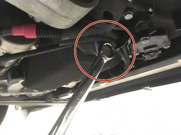 Mettre un bac sous le véhicule