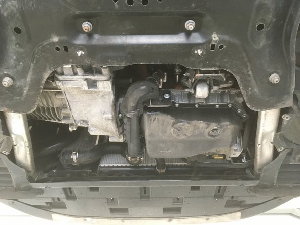 
Reassemble the plate under the engine
