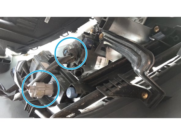 
Disconnect the power cables from the front headlights and fog lights.
