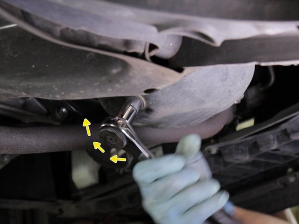 Placer un bac sous le carter.