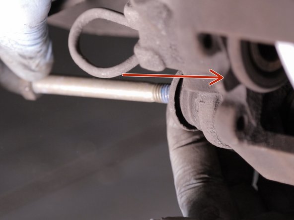 Resserrer la vis du haut de l’étrier