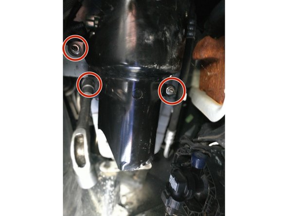 dévisser les 3 écrous de la tôle de fixation du porte-filtre, clé de 10mm, et retirer celle-ci