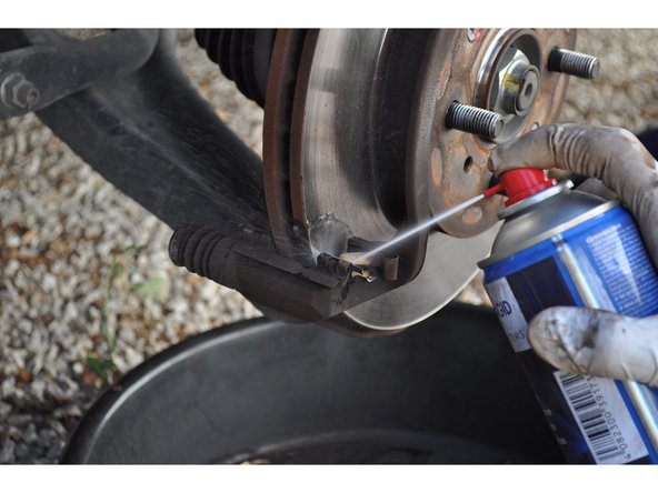 
Use brake cleaner and a wire brush on the pad contact points.

