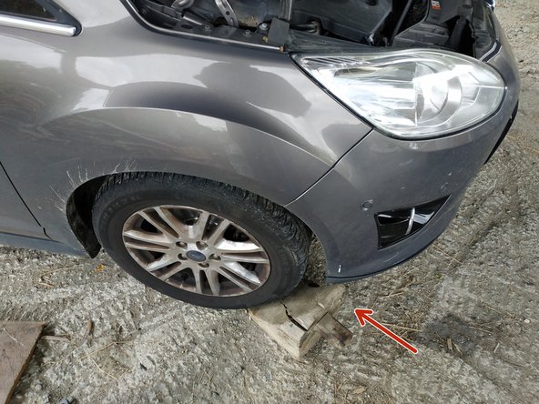 caler les roues avant et relâcher le frein à main