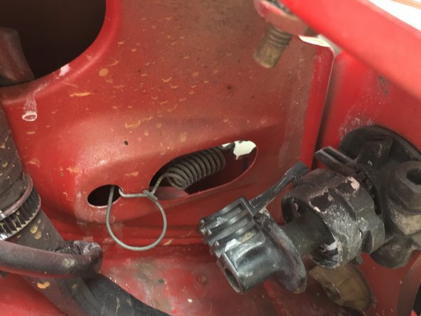 
Insert the hook into the hole to leave the spring under tension, so as to hold the turn signal light
