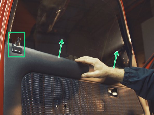 
Pull the door panel upwards, guiding the locking latch into its hole
