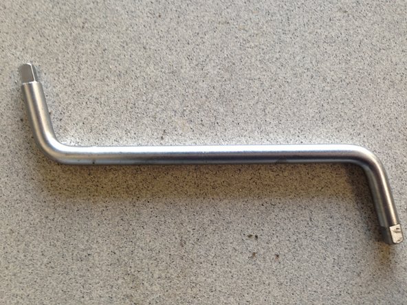 Placer un bac de vidange sous le véhicule