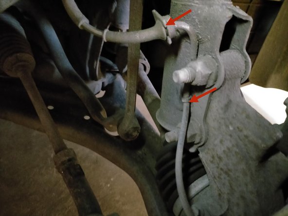 Dégager le faisceau du capteur abs de l'amortisseur.