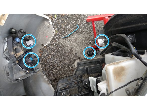 
Disconnect the power cables from the front headlights and fog lights.
