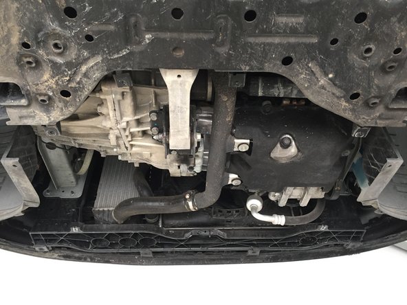 
Reassemble the plate under the engine
