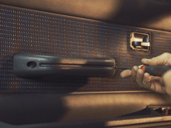 
Replace the armrest and tighten the two screws with a Torx T30
