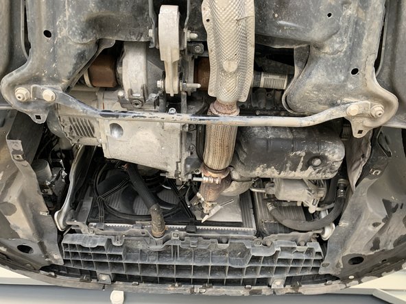 Remonter la plaque sous moteur et serrer les  7 vis de 10