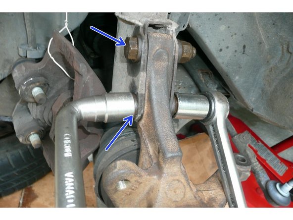 
Remove the 2 shock absorber foot screws (18mm socket wrench and 18mm socket)
