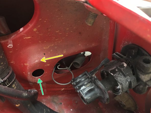 
Pull the fixing spring to tension it
