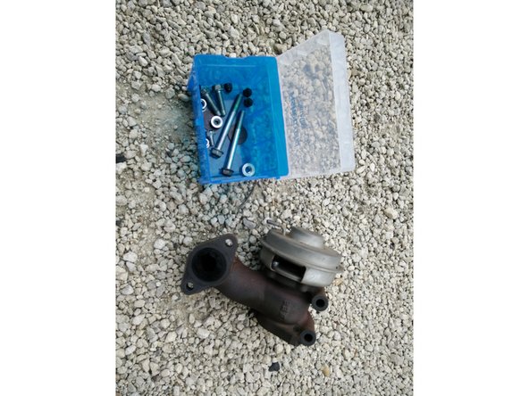 Sortir la vanne du moteur en faisant attention au joint d'étanchéité si vous ne remplacez pas celui-ci