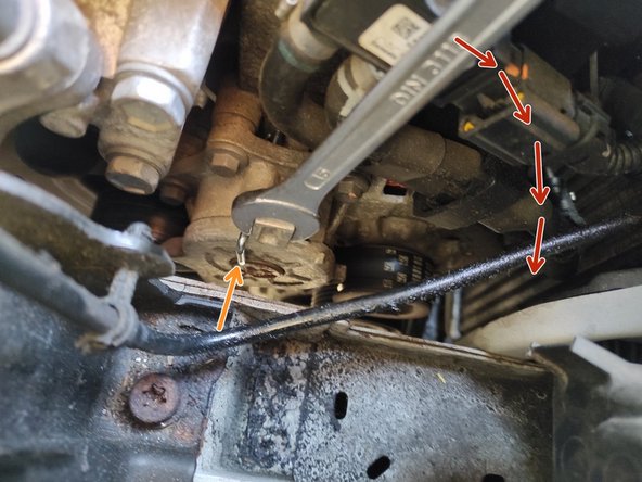 Détendre le tendeur du haut avec une clé plate de 15