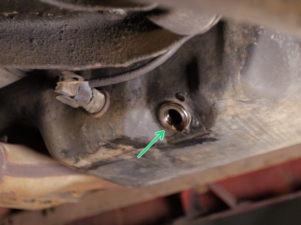 
Replace the oil pan plug by hand
