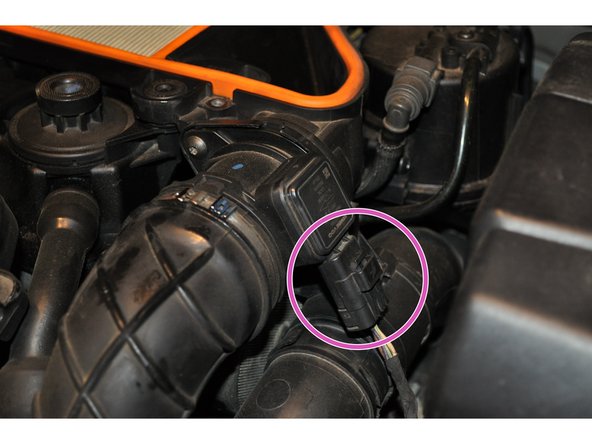 
Disconnect the electrical connector from the air mass meter

