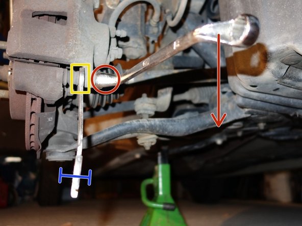 Déblocage du boulon inférieur, puis du boulon supérieur de l'étrier.