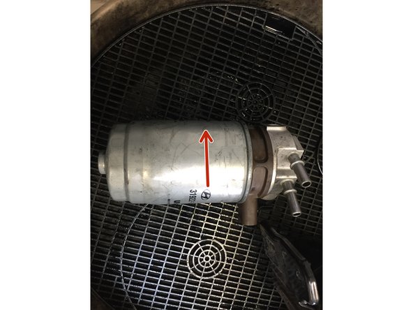 
Unscrew the old filter using the strap wrench
