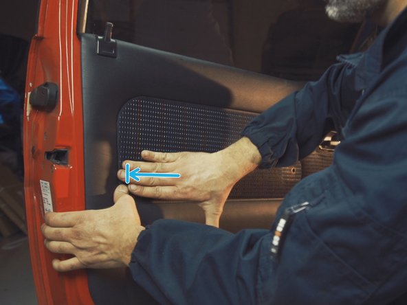 
Press the different parts of the door panel to engage the clips
