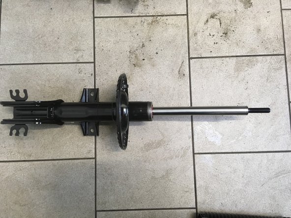 Monter la protection sur l'amortisseur