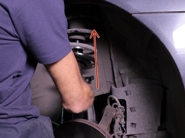 Replacer l'amortisseur  dans son emplacement en commençant par le haut